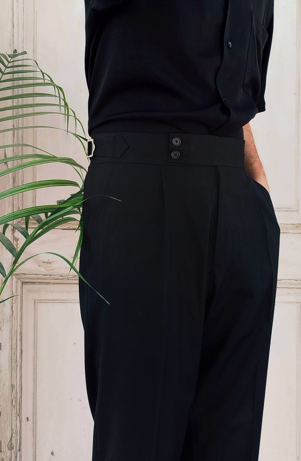 Premium black formal pants for men styled with minimal and modern menswear