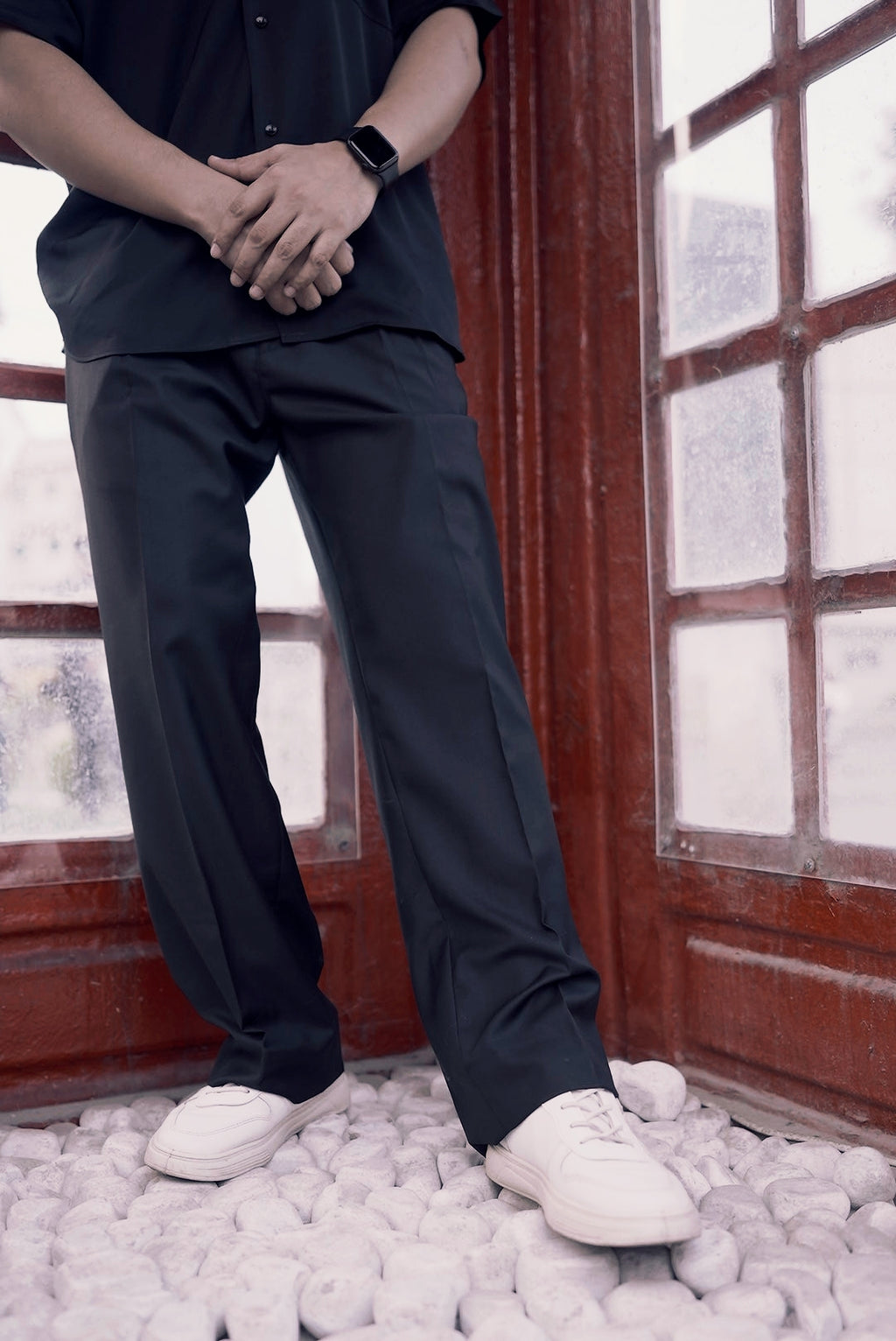 Wide leg black pleated pants designed for fluid movement and comfort