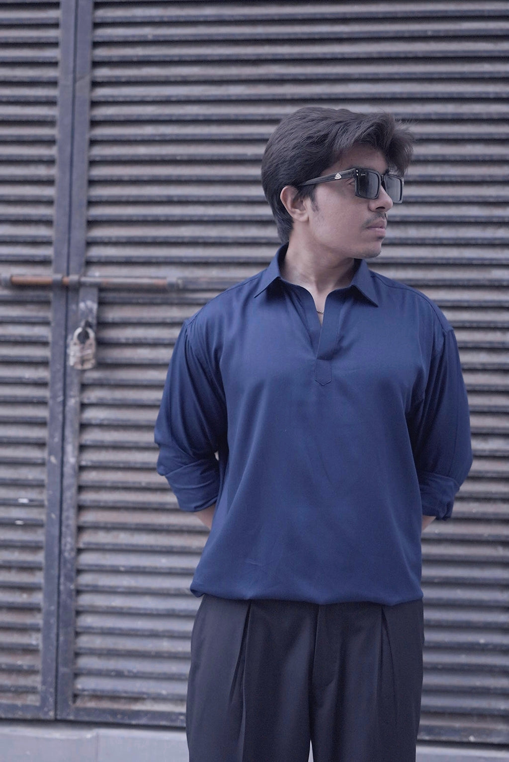 drape of navy blue open collar men’s shirt