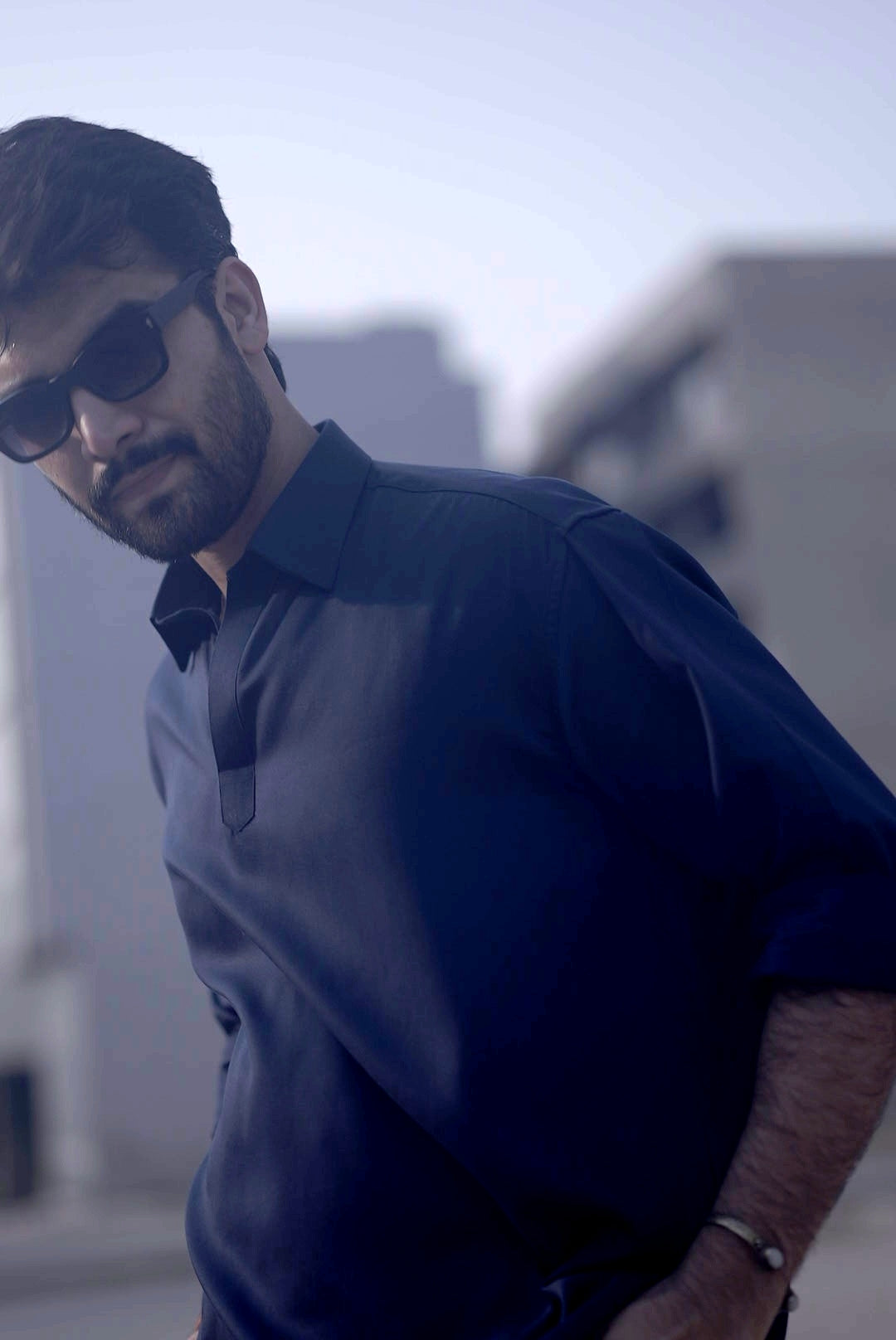 Side angle of navy shirt showing drop shoulder design