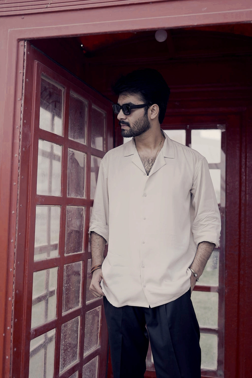 Side angle of sand cuban shirt showing relaxed structured silhouette