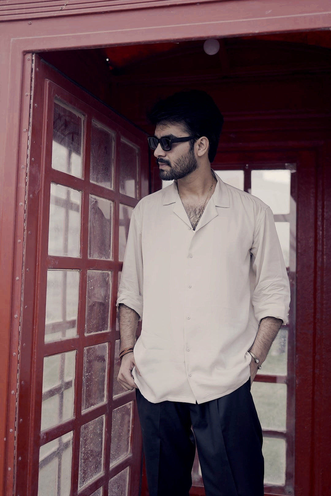 Side angle of sand cuban shirt showing relaxed structured silhouette